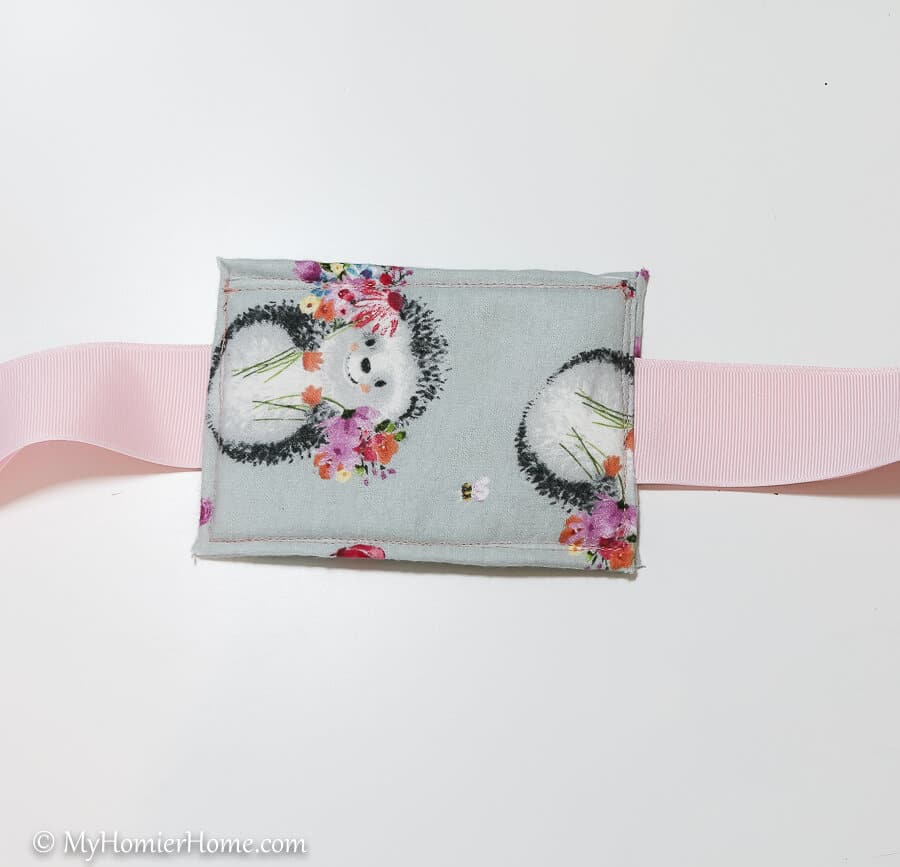DIY Door Muff-17 Sew the ribbon and pieces together.