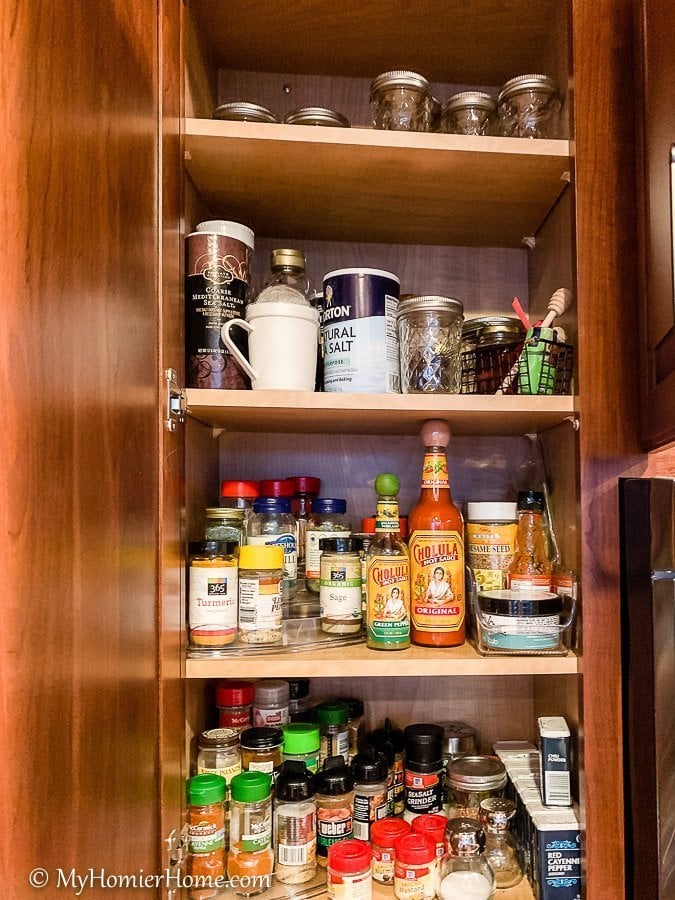 How to Organize Kitchen Cabinets-21 How to organize your kitchen cabinets using clear and simple strategies to tackle kitchen cabinet dysfunction without losing your mind. The spices cabinet before... yikes!
