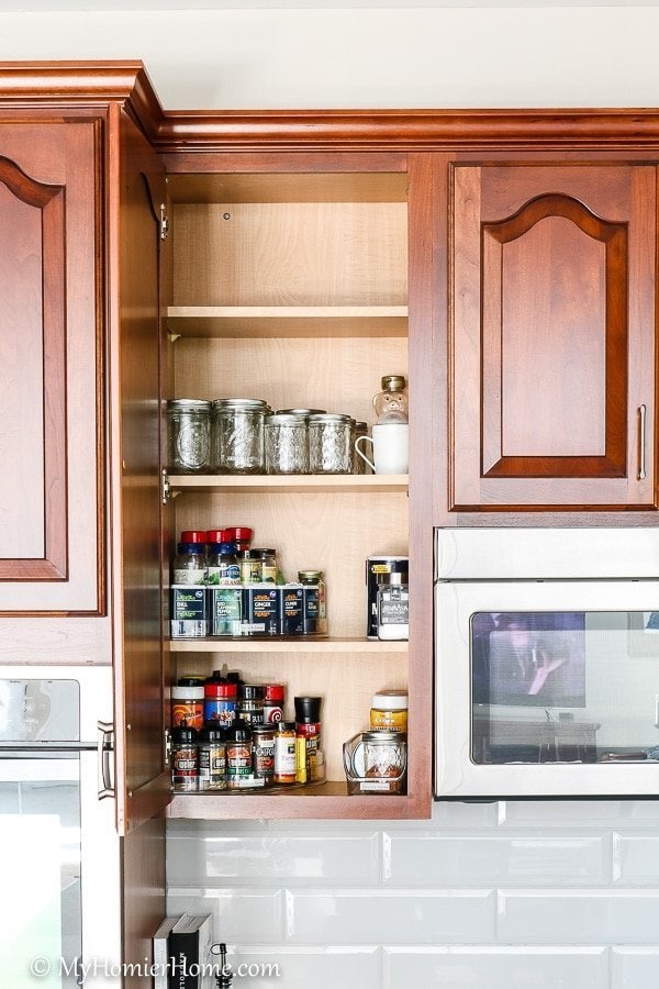 How to Organize Kitchen Cabinets-5 How to organize your kitchen cabinets using clear and simple strategies to tackle kitchen cabinet dysfunction without losing your mind. The spices cabinet after... booya!