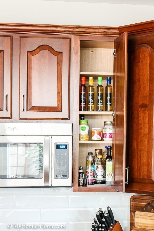 How to Organize Kitchen Cabinets-7 How to organize your kitchen cabinets using clear and simple strategies to tackle kitchen cabinet dysfunction without losing your mind. The oil and miscellaneous cabinet after... oh ya!