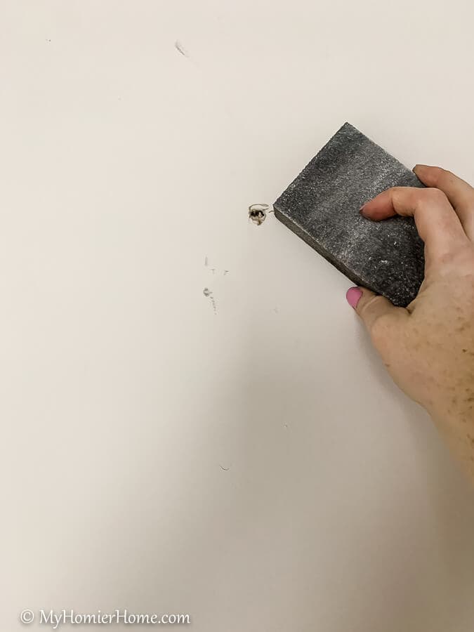 how to hang peel and stick wallpaper Make sure the wall underneath where you will hang your peel and stick wallpaper is smooth. You can use a sanding block for this.